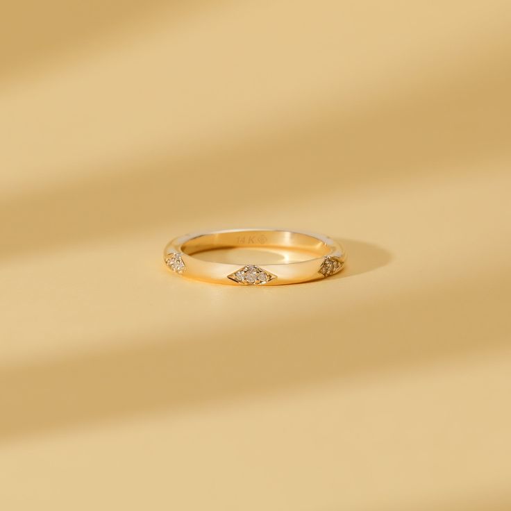 Nadia This minimalist wedding band features diamonds spaced apart, symbolizing the journey and moments shared. Handmade with genuine craftsmanship, this delicate and dainty ring is the perfect choice for bridal jewelry, offering a timeless and elegant look. Add to your solid gold ring stack to create unique interest, yet stunning to wear alone! - Handmade- Solid Gold- Natural Diamonds - G Color, SI Quality Diamonds- Total Diamond Carat Weight: 0.26 ctw- The Thickness of the Band: 2 mm All pieces Minimalist Wedding Band, Champagne Bubbles, Solid Gold Ring, Ring Stack, Gold Ring Stack, Diamonds And Gold, Solid Gold Rings, Diamond Carat, Diamond Cluster Ring