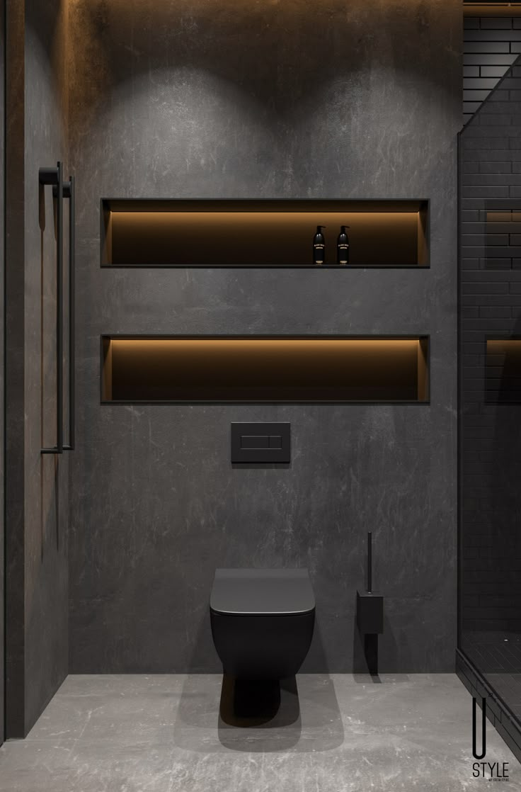 a modern bathroom with black walls and shelves on the wall, along with a toilet