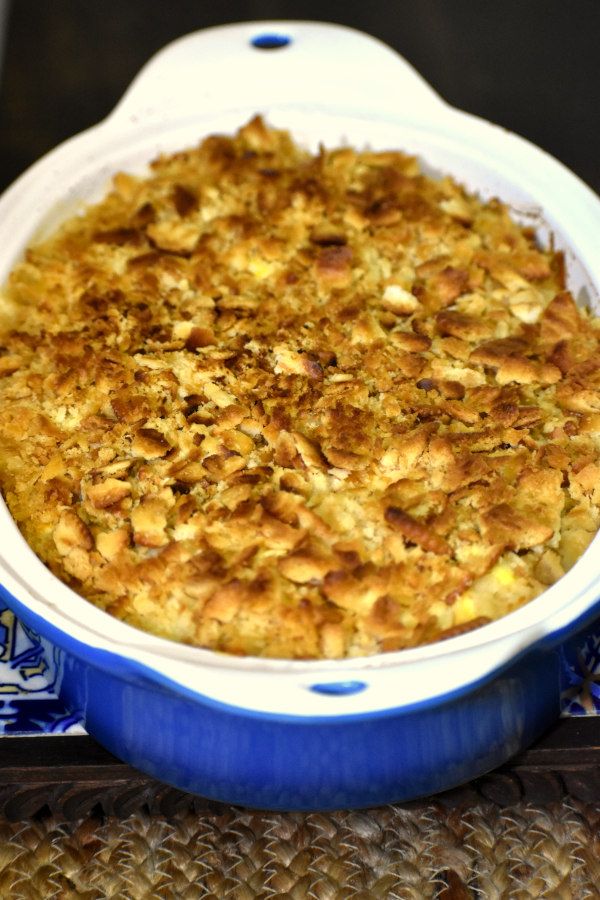 a casserole dish filled with food on top of a blue and white plate