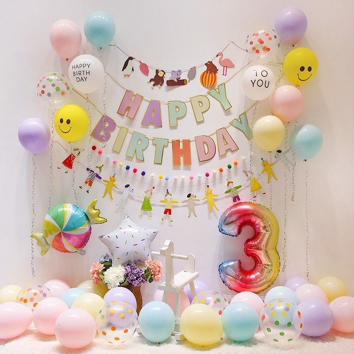 a birthday party with balloons and decorations