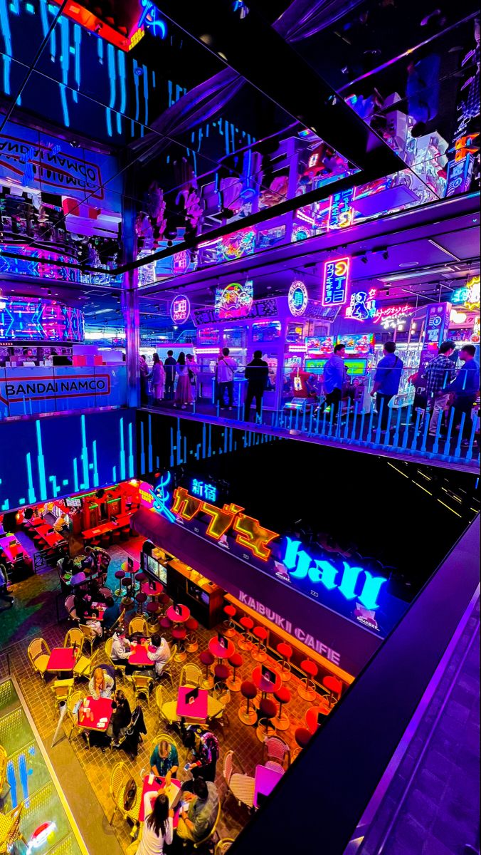 a brightly lit room filled with lots of furniture and neon lights on the ceiling above