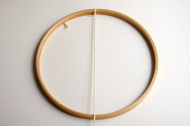 a piece of wood that has been made to look like a circle with two strings