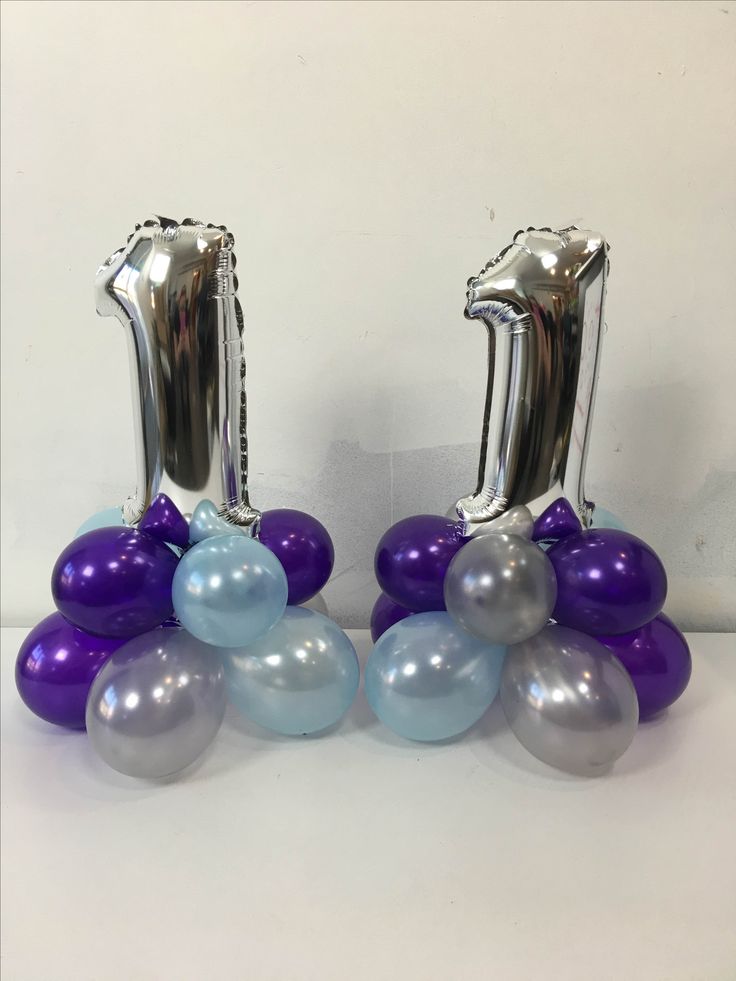 balloons are arranged in the shape of numbers one and two