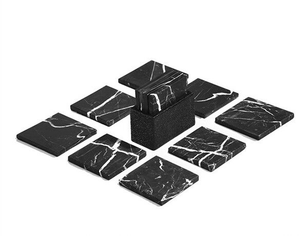 black and white marble coasters are arranged in the shape of squares