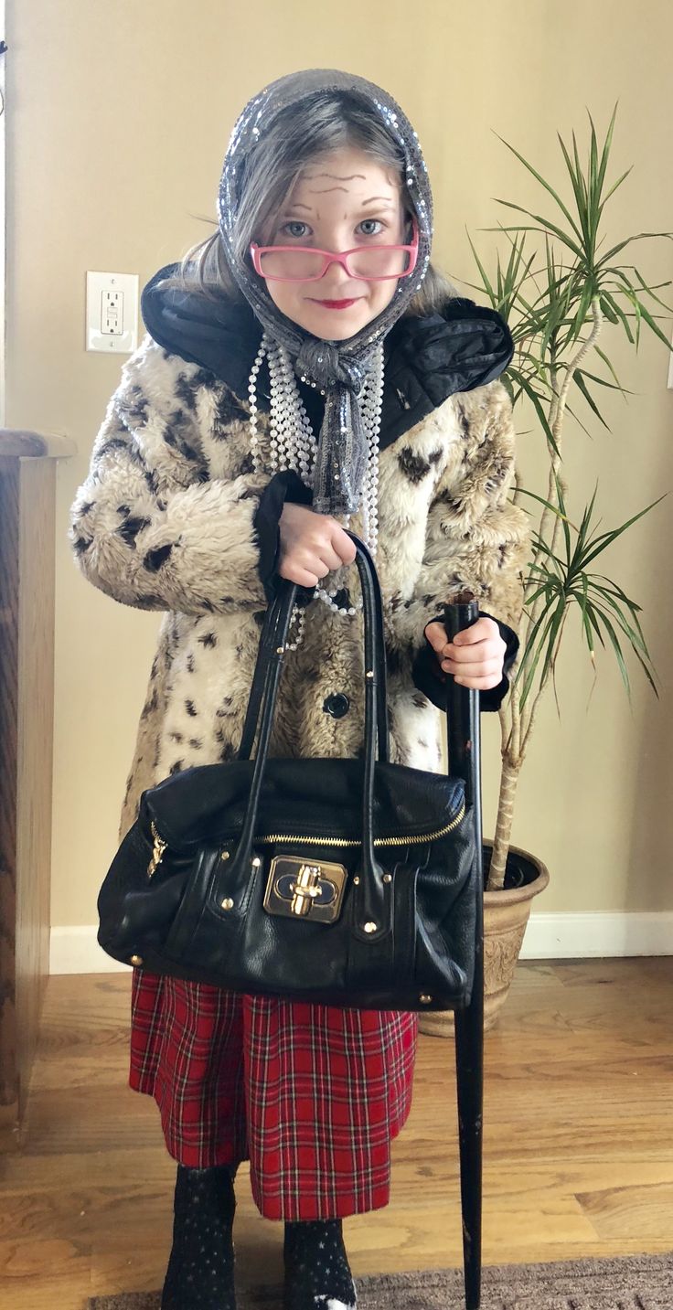 a woman in a fur coat holding a black purse