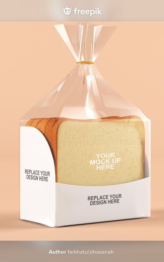 a white box with a piece of bread in it on top of a pink background