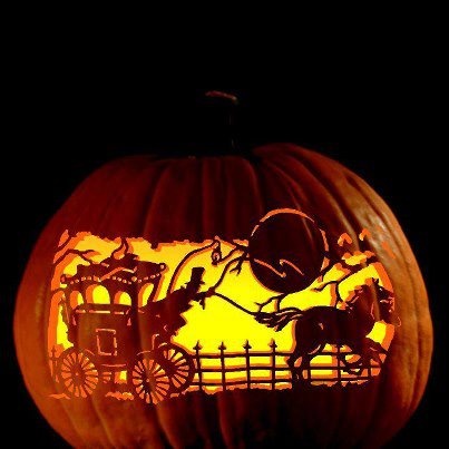 a pumpkin carved to look like a horse drawn carriage