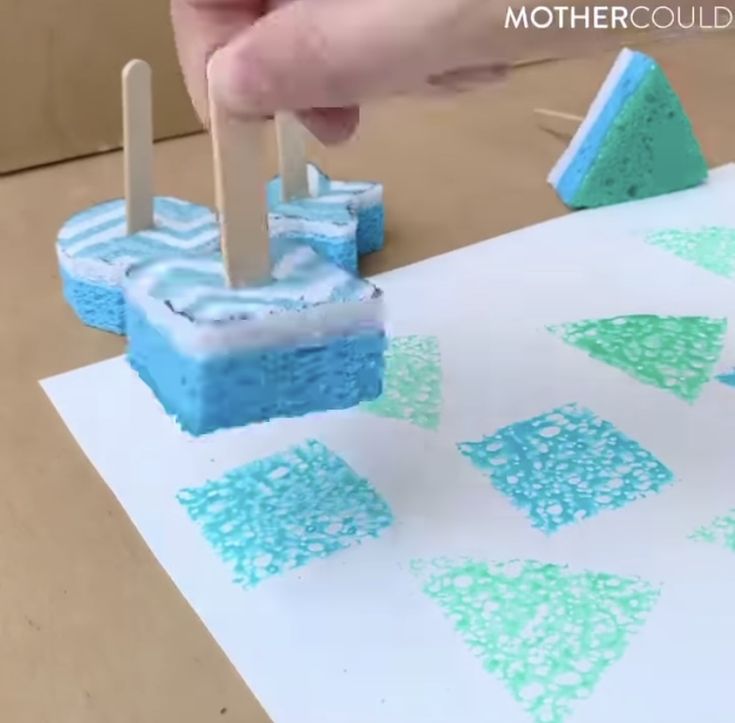 someone is making something out of marshmallows with toothpicks on them