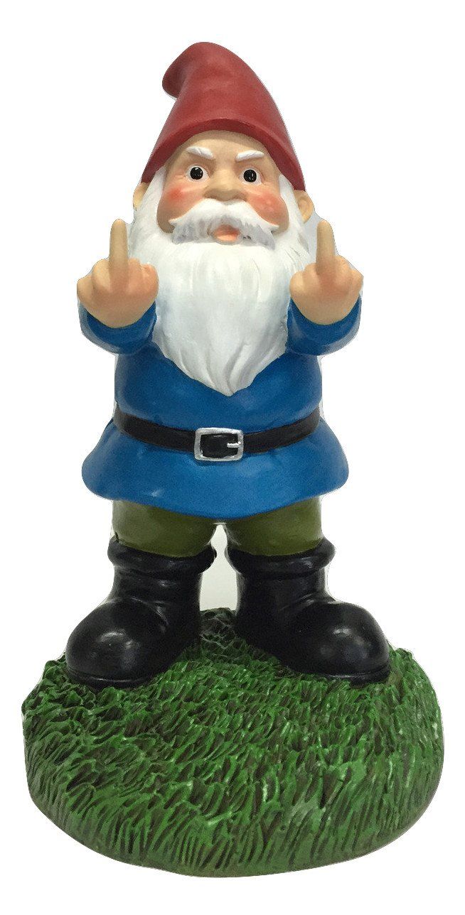 a gnome figurine sitting on top of a green grass covered field with his hands in the air