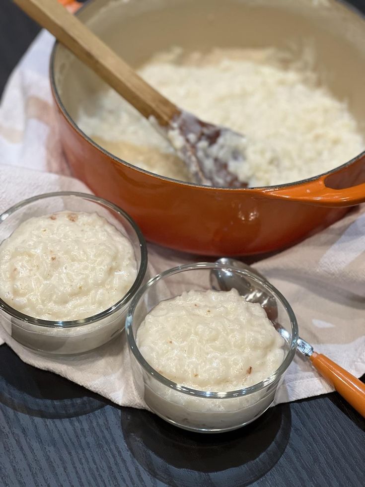 two bowls filled with rice sitting on top of a table