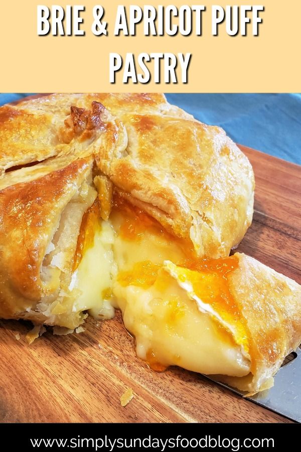 a close up of a pastry on a cutting board with the words brie and apricot puff pastry