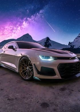 a white chevrolet camaro is parked in front of the mountains under a purple and blue sky