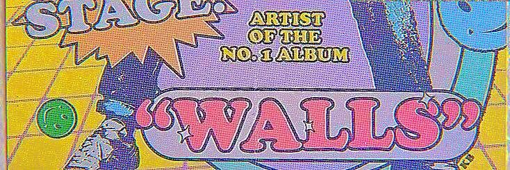 an advertisement for wall's on the side of a brick wall with graffiti writing