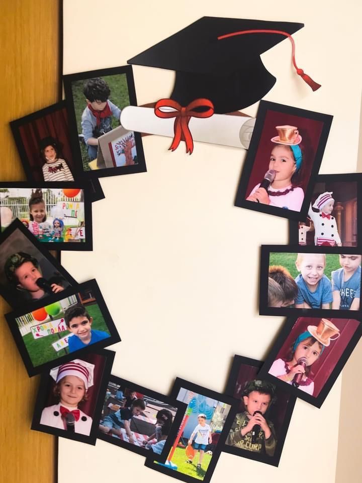 a graduation cap is hanging on the wall with many photos attached to it, and there's a red ribbon in the middle