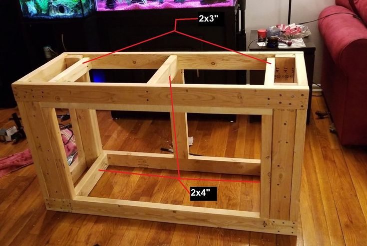 an image of a fish tank being built in the living room with measurements for it