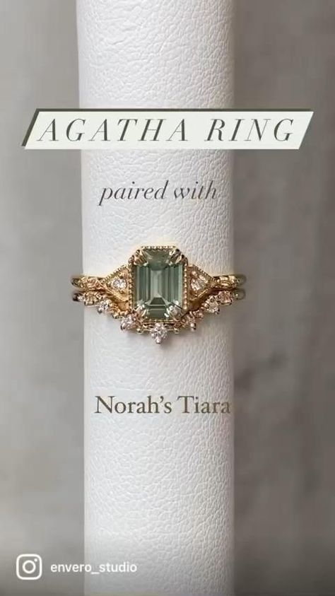 a ring with an emerald stone on it