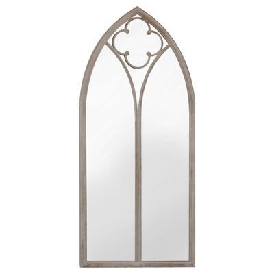 an arched mirror with a metal frame and decorative design on the front, against a white background