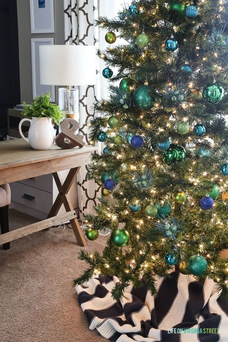 a christmas tree with green and blue ornaments