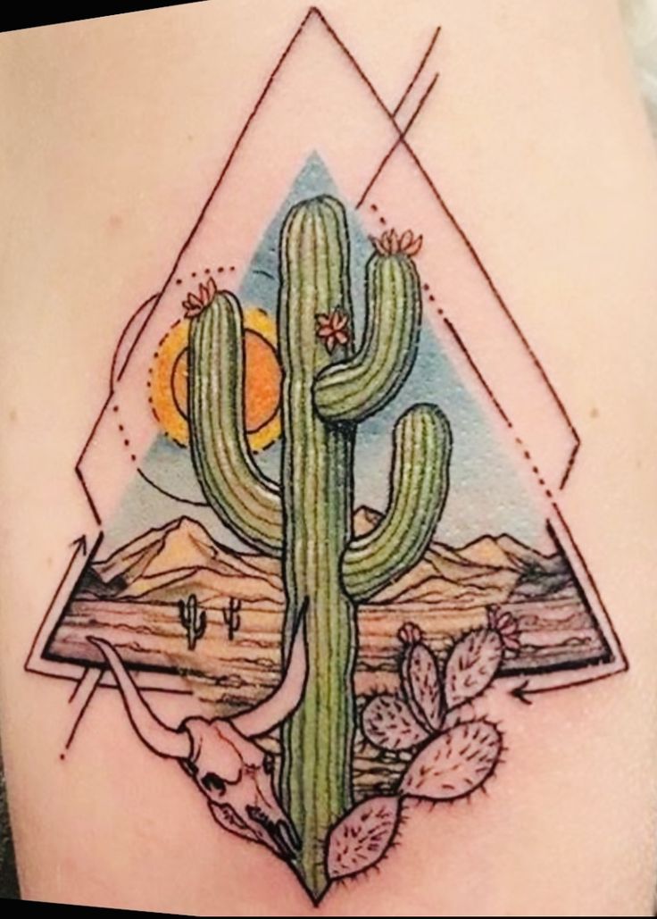 a cactus tattoo on the back of a woman's thigh