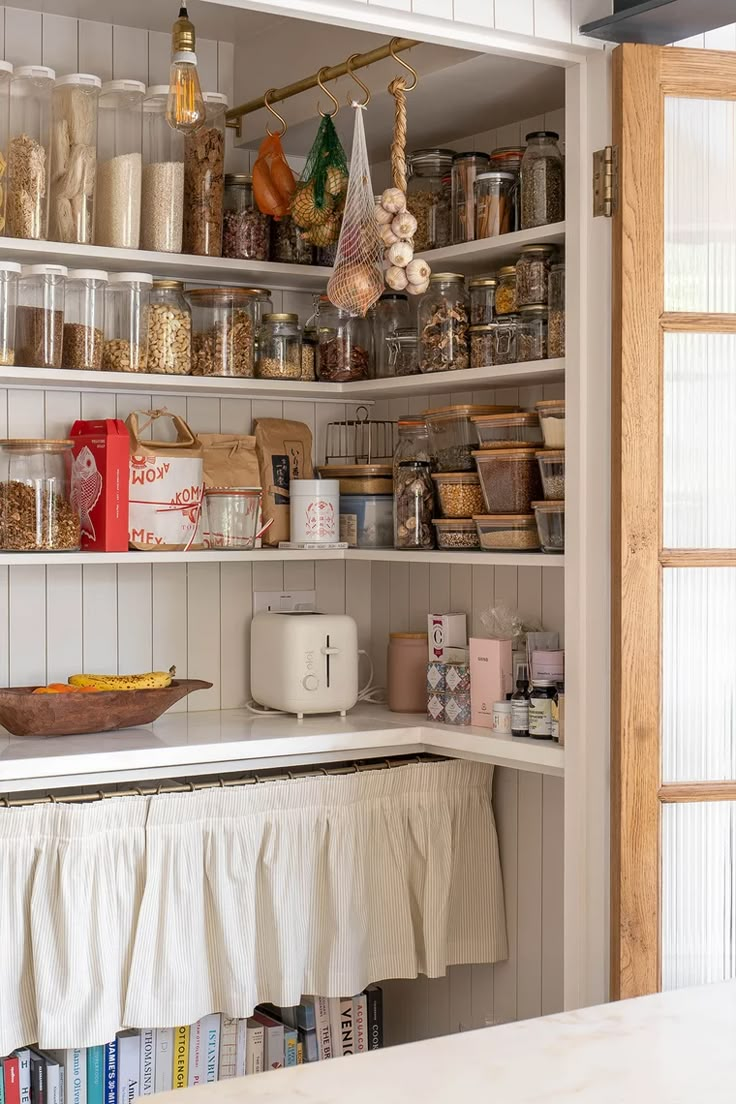 an organized pantry with lots of items on the shelves