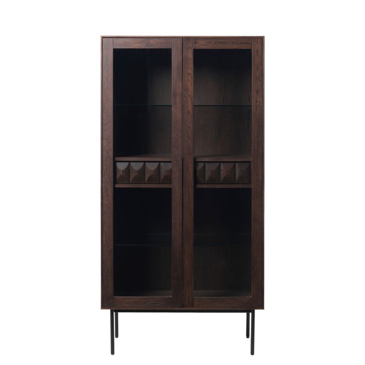 a wooden cabinet with glass doors and metal legs on the bottom, against a white background