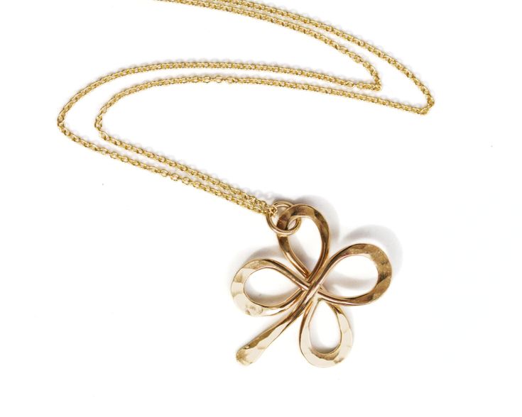 Discover the world of artisan handcrafted jewelry with our beloved Four-Leaf Clover Pendant Necklace. Meticulously handcrafted with care, this necklace is a testament to our dedication to quality and artisanship. The clover pendant, symbolizing hope, faith, love, and luck, is delicately handmade from your choice of 14 karat yellow gold filled or .925 sterling silver material. This pendant, a delightful 3/4" or 22mm square, bears the mark of artisanal expertise, featuring a charming hand-hammered Love And Luck, Clover Pendant, Bold Necklace, Faith Love, Clover Necklace, Lucky Clover, Wide Band Rings, Leaf Clover, Silver Material