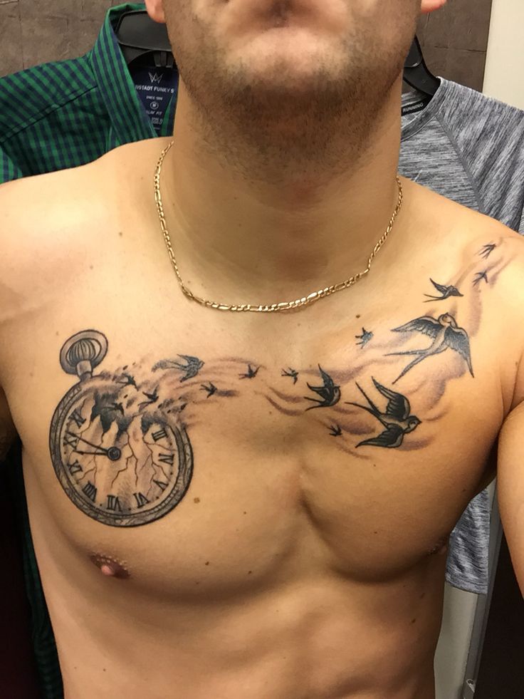 a man with a clock tattoo on his chest