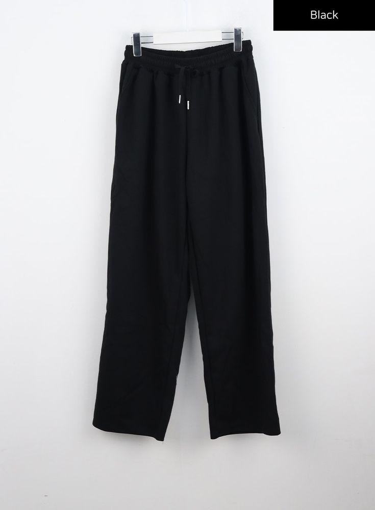 wide-fit-bandedsweat-pants-co330 / Black Black Wide-leg Lounging Pants, Black Wide Leg Pants For Lounging, Spring Wide Leg Lounging Pants With Drawstring, Black Wide Leg Pants With Elastic Waistband For Loungewear, Wide-leg Drawstring Pants For Lounging, Relaxed Black Loungewear Pants, Black Relaxed Sweatpants With Elastic Waistband, Comfortable Black Wide-leg Pants, Relaxed Black Pants With Elastic Waistband