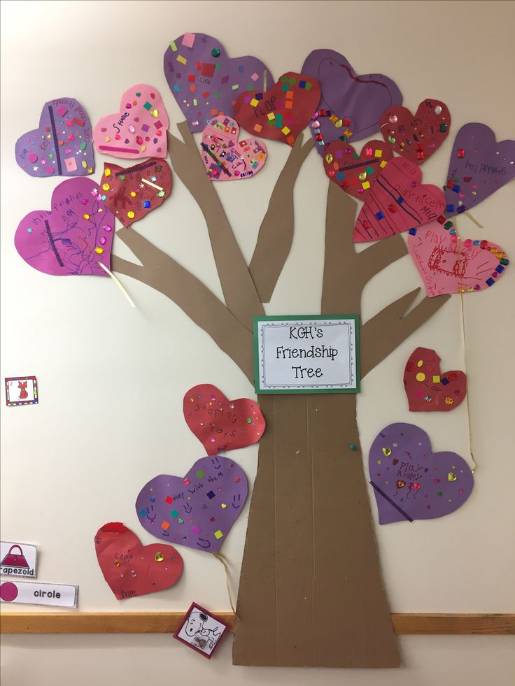 a bulletin board with hearts attached to a tree