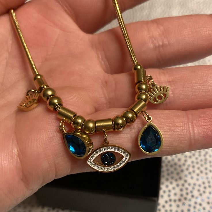 Eye & Rhinestone Decor Pendant Necklace Beautiful As A Gift #157tt) Blue Metal Necklace With Charms, Blue Charm Jewelry For Party, Blue Metal Charm Necklaces, Elegant Blue Metal Charm Necklaces, Blue Jeweled Necklace For Gift, Rhinestone Decor, Blue Gold, Color Blue, Necklaces