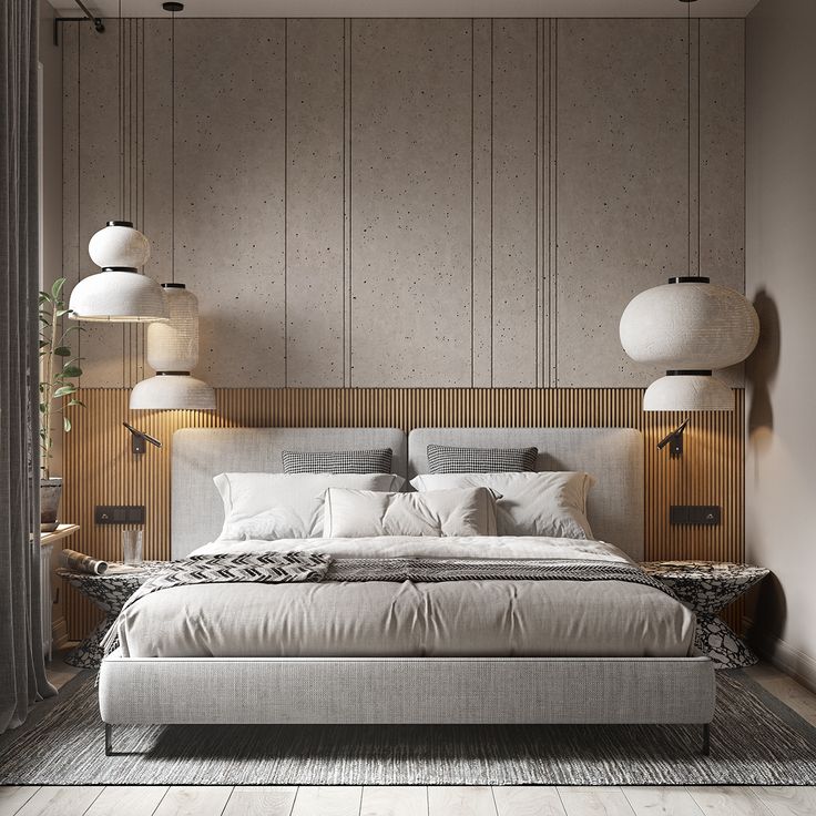 a large bed sitting in the middle of a bedroom next to two lamps on either side of it