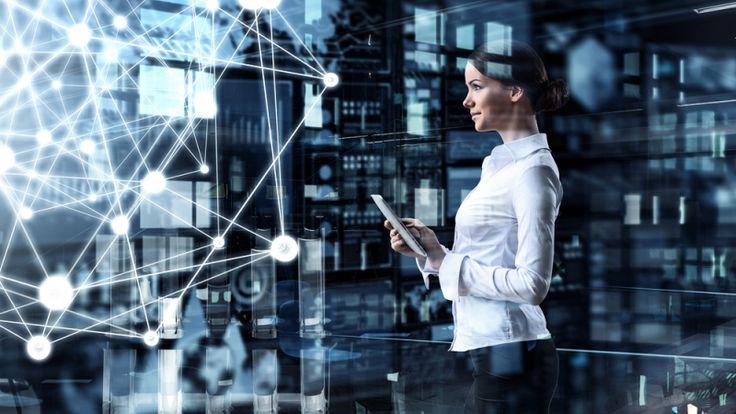 a woman is looking at her tablet while standing in front of a cityscape