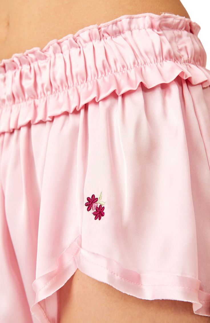 Silky satin refines these buttery-soft pajama shorts finished with a smocked elastic waist and a flouncy hemline. 2 1/2" inseam; 38" leg opening; 12" front rise; 15" back rise (size Medium) Elastic waist 100% polyester Hand wash, line dry Imported