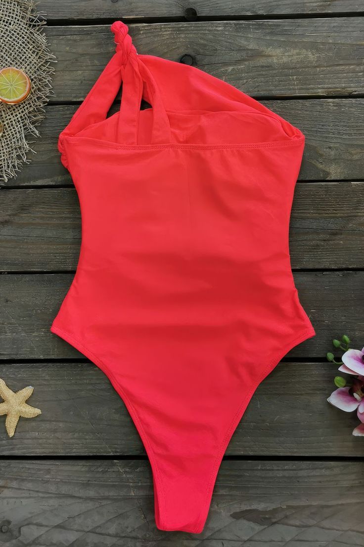 Product Name: Red One Shoulder Cross Monokini Swimsuit Fabric composition: 88% nylon 12% spandex. Weight: 400g/0.9lb. Size: S, M, L Color: Red Package Contains: One Piece Swimsuit x1 Bottom Style: Mid Waist One Piece Style: One-piece swimsuit with removable chest pad. Garment Care: Washing your swimsuit by hand in cold water is a gentle and effective way to keep it looking its best. Red Stretch Nylon Bodysuit, Solid Color Backless One-piece Swimsuit, Red One-piece Nylon Swimwear, Red Stretch One Piece With Lined Body, Red Stretch Tankini For Poolside, Red Stretch One-piece With Lined Body, Red Nylon One-piece Swimwear, High Stretch Backless Swimwear, Red Stretch One-piece Swimsuit