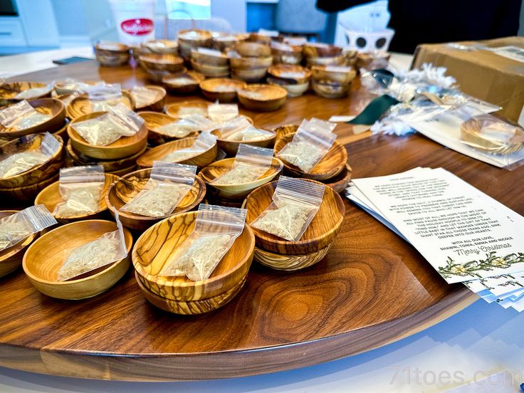 several wooden bowls with food in them on a table