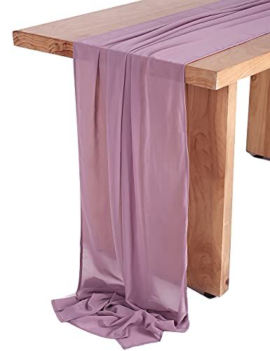 a wooden bench with a purple cloth draped over it