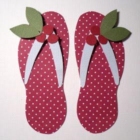 two pairs of red flip flops with white polka dots and green leaves on them