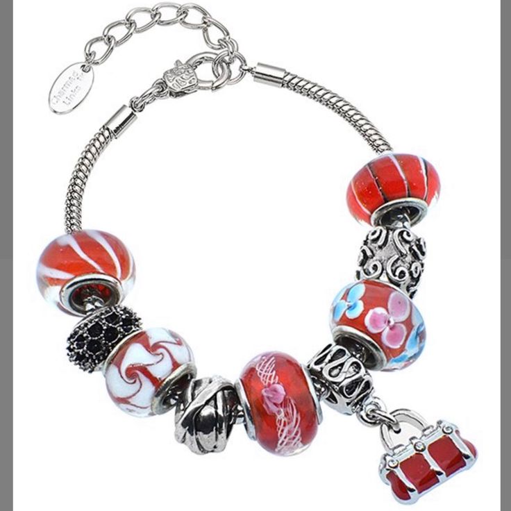 Beautiful Charm Bracelet Features Red And White Murano Glass Beads, Rhodium Plated Stainless Steel Carved Charm Beads, And The Beautiful Red Purse Dangling Charm. The Bracelet Is A Sleek Snake Stain Which Is Also Made Of Rhodium Plated Stainless Steel. It Is Approximately 7 Inches Long With A 1.5 Inch Extender. There Is A Lobster Claw Clasp. Red Beaded Charm Bracelet For Jewelry Making, Red Spacer Beads Jewelry Gift, Red Spacer Beads Jewelry As Gift, Red Beaded Jewelry For Holidays, Red Metal Crystal Bracelet Gift, Silver Jewelry With Round Beads For Holidays, Elegant Multicolor Jewelry For Holidays, Elegant Multicolor Holiday Jewelry, Elegant Red And Silver Beads