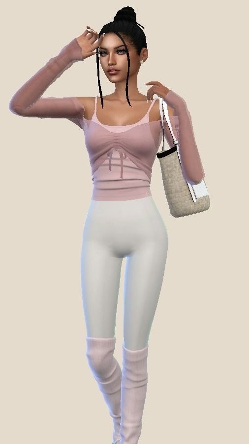 a woman in tight white pants and pink top holding a handbag with her right arm