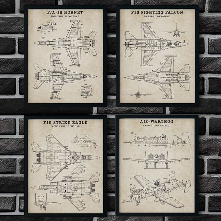 four framed blueprints of fighter jets on a brick wall with bricks in the background