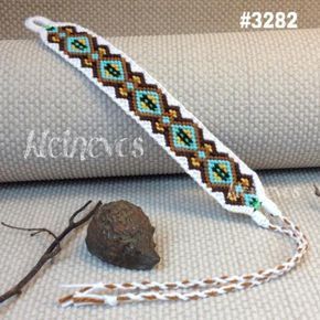 the beaded bracelet is next to a rock