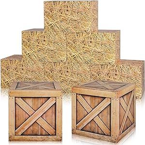 three wooden boxes are stacked on top of each other in front of straw bales