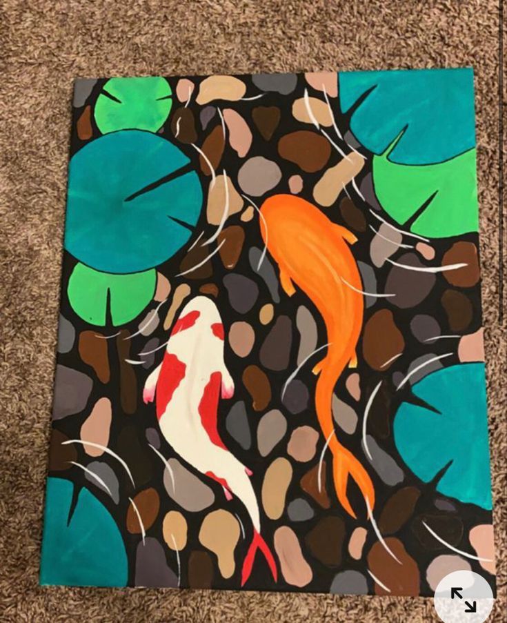 an image of a painting on the ground with koi fish and leaves in it