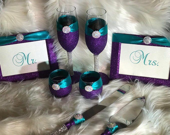 purple and teal wine glasses with matching napkins, place cards and silverware