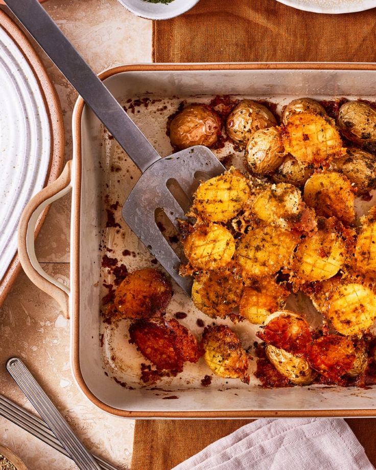 a casserole dish with potatoes and meat in it