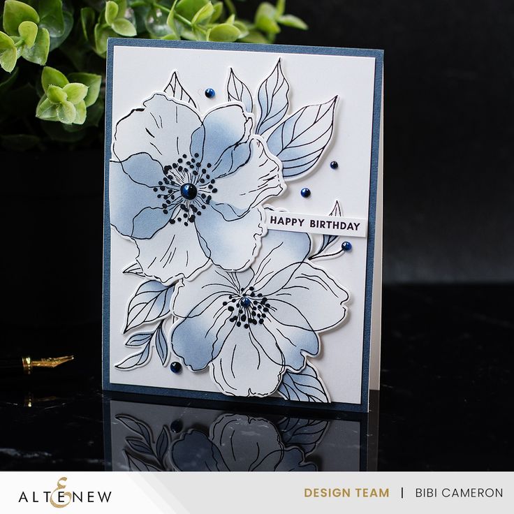 a close up of a card with flowers on it