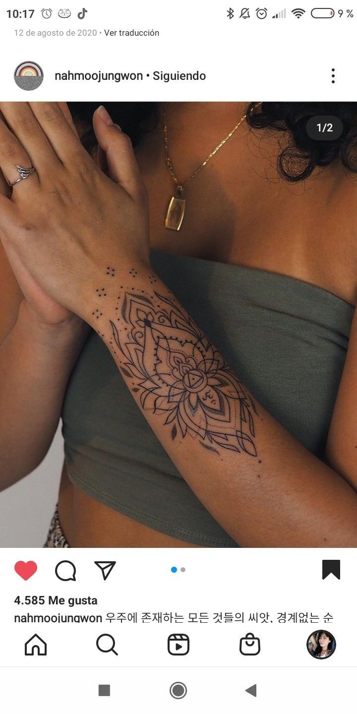 a woman with a tattoo on her arm