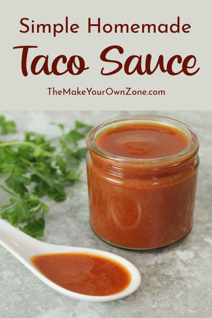 simple homemade taco sauce in a jar with a spoon and parsley on the side