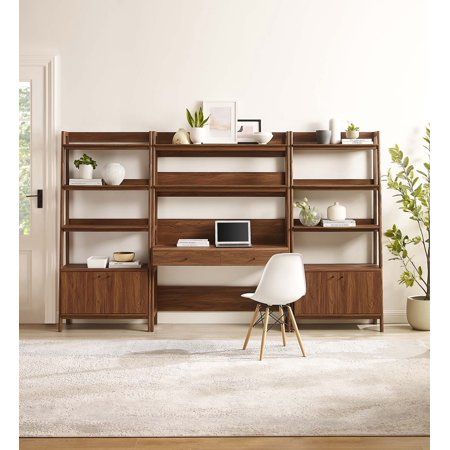 a living room filled with lots of furniture and plants on top of bookshelves