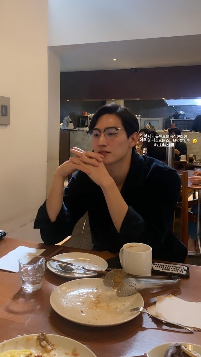 a woman sitting at a table eating food